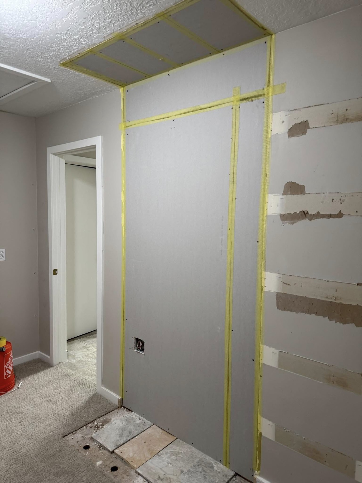 Before: Water-damaged ceiling, rebuilt