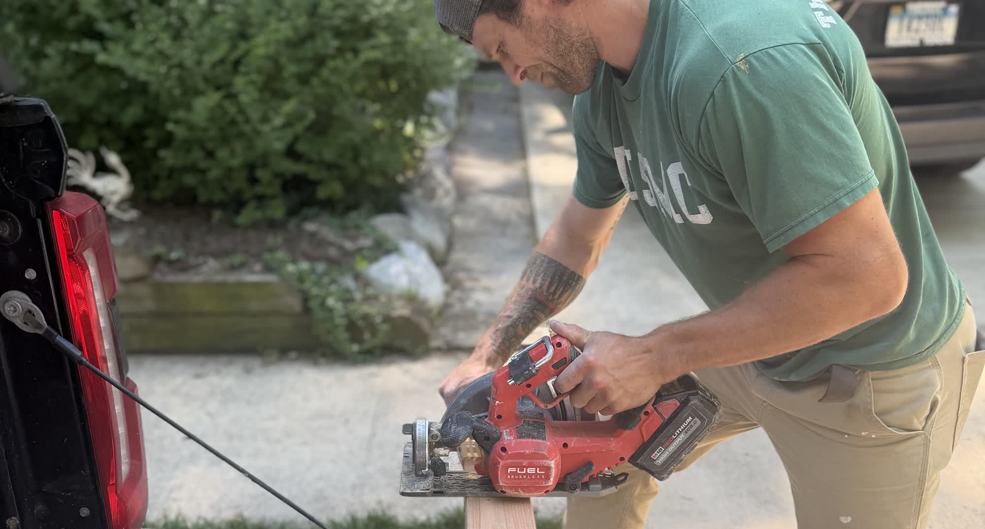 Brandon, founder of Veteran Home Solutions, cutting lumber on a job